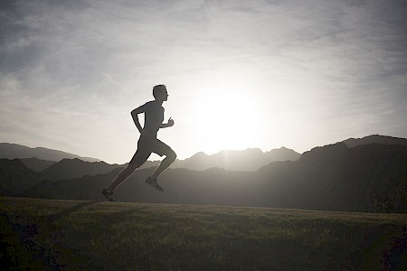 Man running on a trail