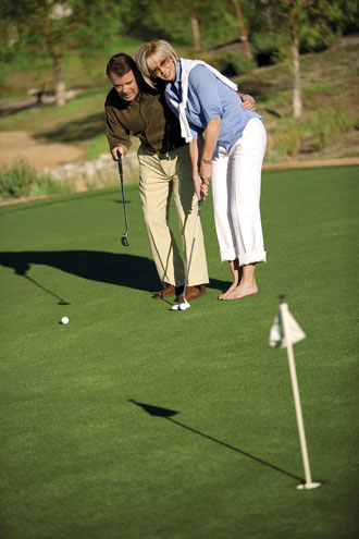 Couple enjoying golfing together